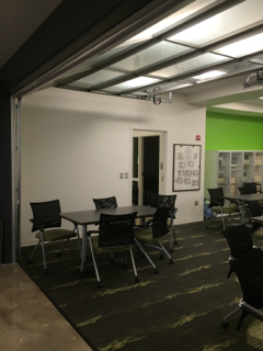 MITH presentation area showing garage-style main door